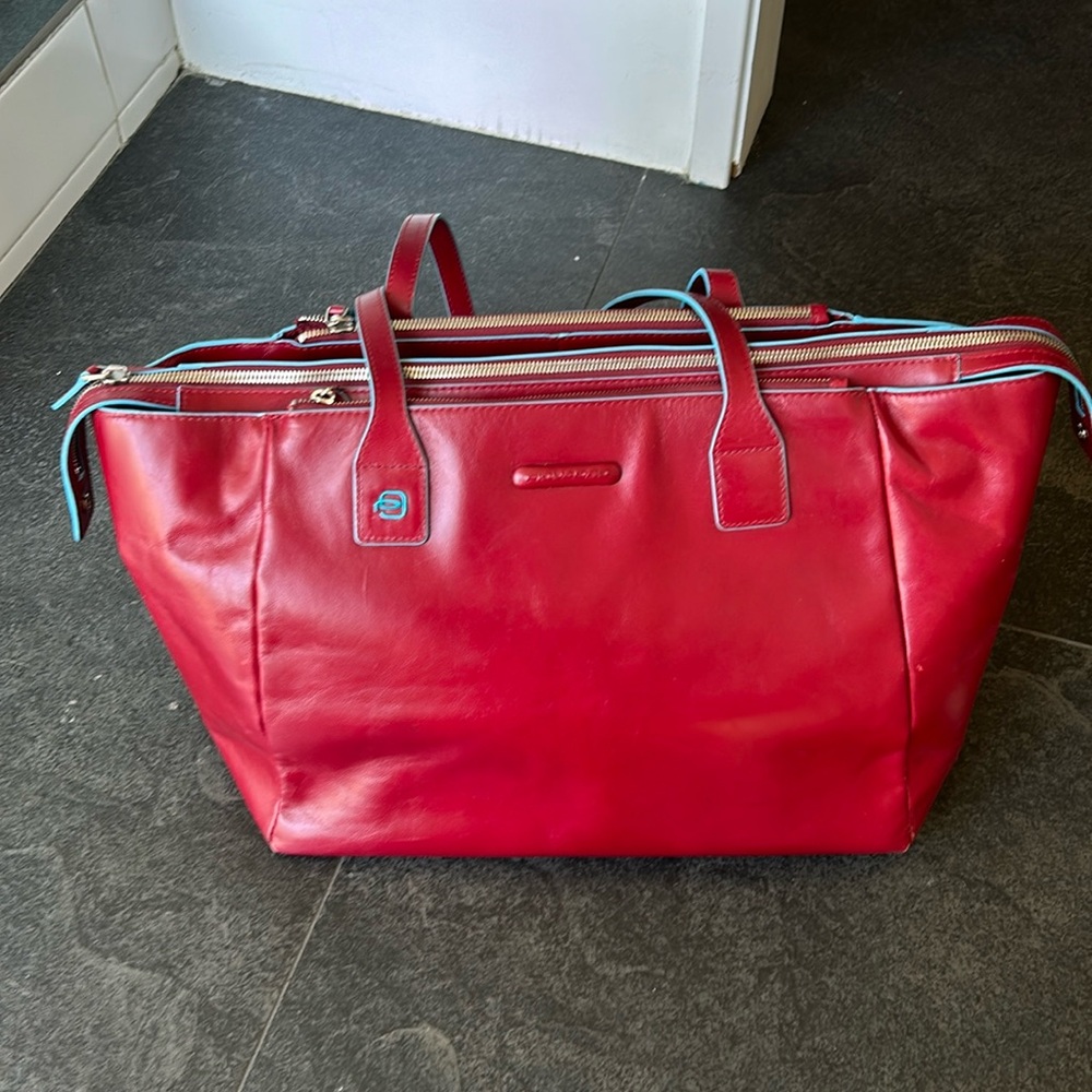Piquadro laptop bag red leather teal accent, used